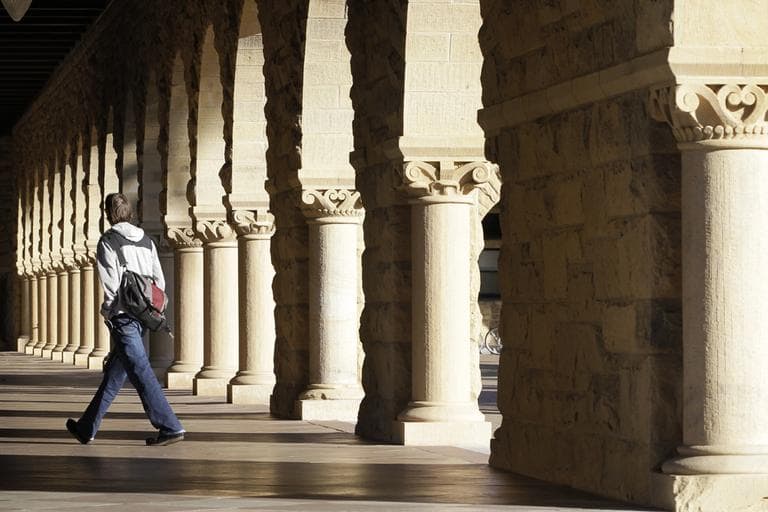 A Stanford University student walks though the halls of the Stanford University campus in Palo Alto, California. (AP)