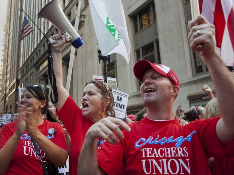 Public school teachers cheer as they march on streets surrounding the Chicago Public Schools district headquarters on the first day of strike action over teachers' contracts on Monday, Sept. 10, 2012 in Chicago. For the first time in a quarter century, Chicago teachers walked out of the classroom Monday, taking a bitter contract dispute over evaluations and job security to the streets of the nation's third-largest city — and to a national audience — less than a week after most schools opened for fall. (AP