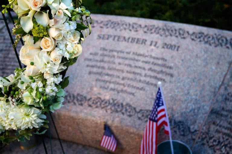 A wreath and flags are seen at the Boston Public Garden 9/11 Memorial on Tuesday. (Jesse Costa/WBUR)