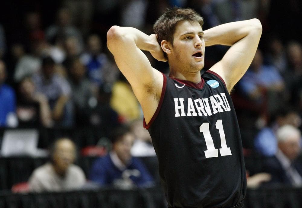 Harvard gaurd Oliver McNally during the NCAA tournament in 2012. McNally's co-captains, Brandyn Curry and Kyle Casey, are implicated in the cheating scandal. (AP)