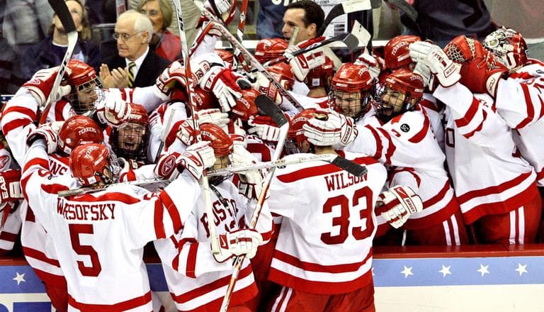 The Boston University men's hockey team celebrates a goal in the 2009 NCAA championship game. The team won the game and the title, but a party after the win has sparked scrutiny of the team and its culture. (AP)