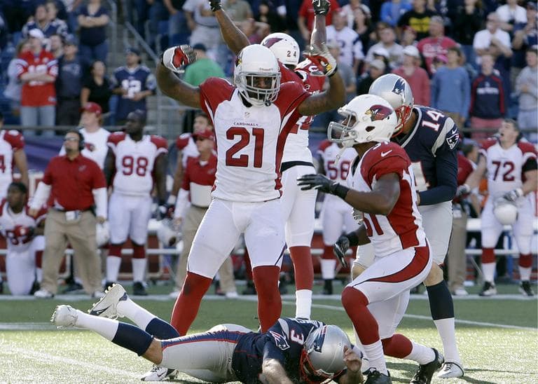 Arizona Cardinals Patrick Peterson and Justin Bethel celebrate after New England Patriots kicker Stephen Gostkowski, on the ground, missed a field at the end of the game Sunday, Sept. 16, 2012.  (AP)