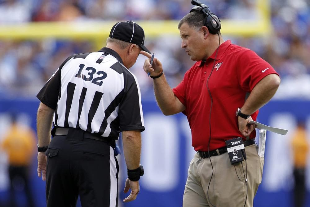 Coach Greg Schiano talks to referee John Parry during the Tampa Bay Buccaneers game against the New York Giants. Until the lockout of regular NFL referees ends, replacement refs will keep calling games. (AP)