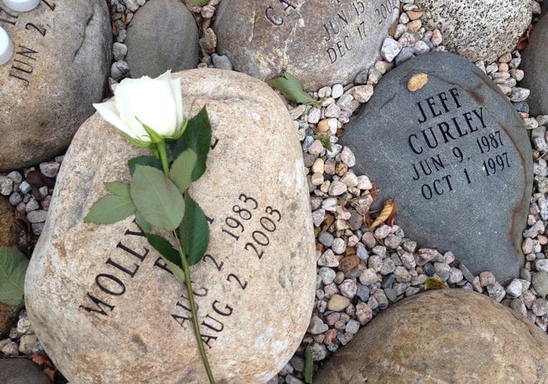 Stones commemorating victims Molly Anne Bish and Jeff Curley (Martha Bebinger/WBUR)