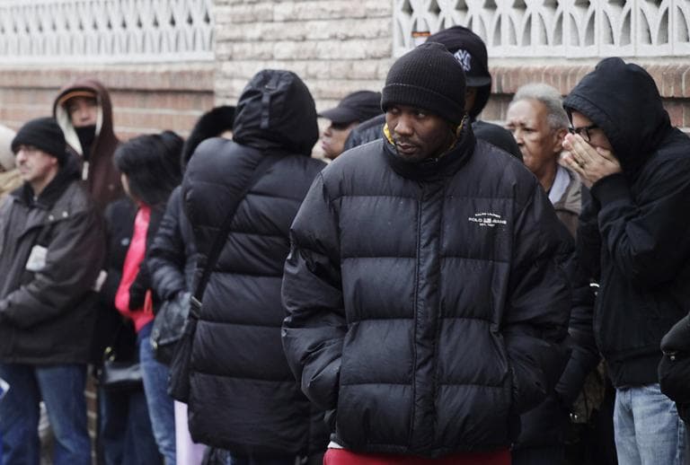 People wait in line to enter the Northern Brooklyn Food Stamp and DeKalb Job Center in February in New York. (AP)