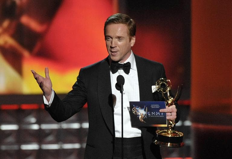 Damian Lewis accepts the award for Outstanding Lead Actor In A Drama Series for &quot;Homeland&quot; at the Emmy Awards on Sunday. (AP)