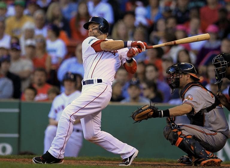 Red Sox&#039;s Cody Ross hits an RBI double off a pitch by Baltimore Orioles&#039; Luis Ayala allowing Red Sox&#039;s Dustin Pedroia to score in the eighth inning. (AP/Steven Senne)