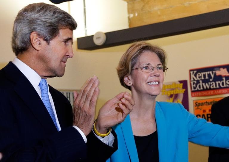 Democratic U.S. Senate candidate Elizabeth Warren is applauded by U.S. Sen. John Kerry at a campaign event in Somerville, Monday. (AP)