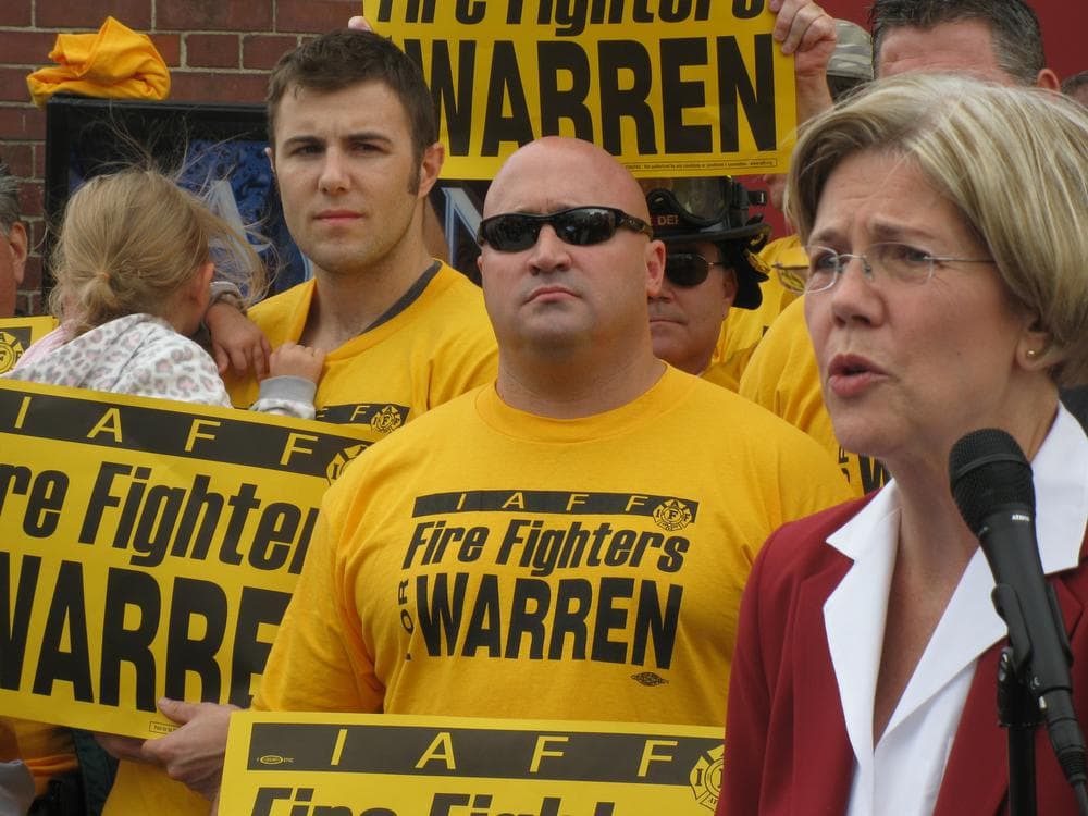 Democratic U.S. Senate candidate Elizabeth Warren accepts the endorsement of the Professional Fire Fighters of Massachusetts in South Boston Wednesday. (Fred Thys/WBUR)