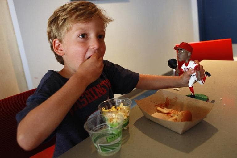 Bryce Blaylock, 5, of Bristow, Va., eating popcorn inside the "peanut-free" suite section of Nationals Park in Washington. Both Blaylock and his younger brother have peanut allergies that keep them from coming to most games. (AP)