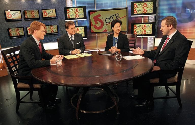 Democrat Joseph Kennedy III, left, and Republican Sean Bielat, right, face off in a WCVB-TV debate on Thursday. Moderating are WCVB's Ed Harding and Janet Wu. (AP/The Boston Globe, Pool)