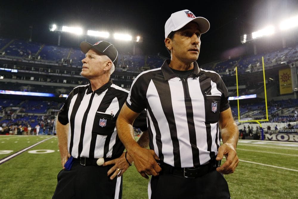 Referee Gene Steratore, right, and back judge Bob Waggoner, left, are two regular NFL officials who returned to work on Thursday. (AP)