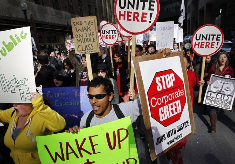 Members of the Occupy Boston movement, students from area colleges, and union workers march through downtown Boston on Nov. 2, 2011. (AP)