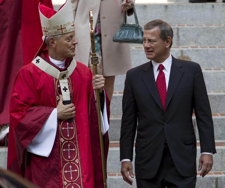 Cardinal Archbishop of Washington Donald Wuerl speaks with U.S. Supreme Court Chief Justice John G. Roberts on the steps of the Cathedral of St. Matthew the Apostle after the 60th annual Red Mass in Washington on Sunday. (AP)