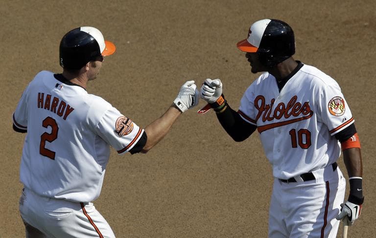 Baltimore Orioles' J.J. Hardy, left, fist bumps teammate Adam Jones after hitting a solo home run in the third inning against the Boston Red Sox Sunday. (AP)