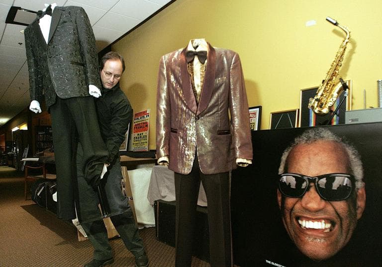 Country Music Hall of Fame curator Mick Buck, left, works on Ray Charles exhibit items on Monday, Feb. 20, 2006 in Nashville, Tenn. (AP)