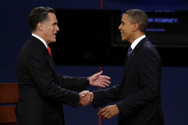 Republican presidential nominee Mitt Romney and President Obama shake hands before the first presidential debate at the University of Denver on Oct. 3. (Charlie Neibergall/AP)