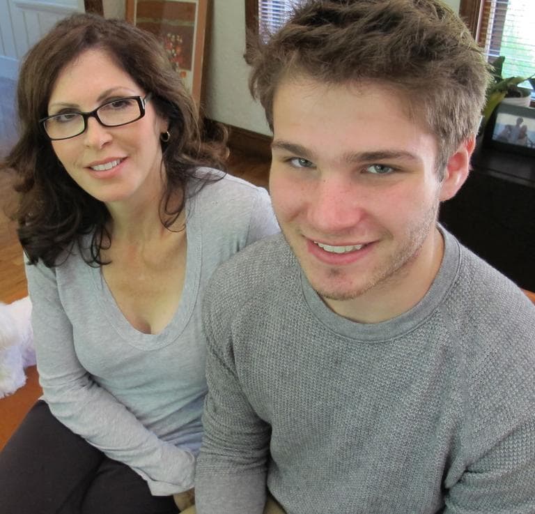 Violinist and composer Murray Skolnick, 16, with his mother Rose at their Brookline home. (Andrea Shea/WBUR)