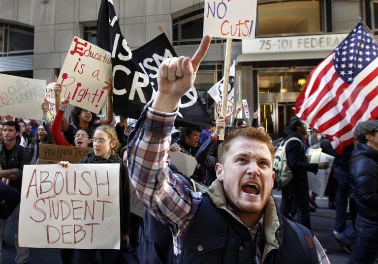 Keegan O&#039;Brien joins with members of the Occupy Boston movement, students from area colleges and union workers as they march through downtown Boston, on Nov. 2, 2011. The march was held to protest the nation&#039;s growing student debt burden. (AP)