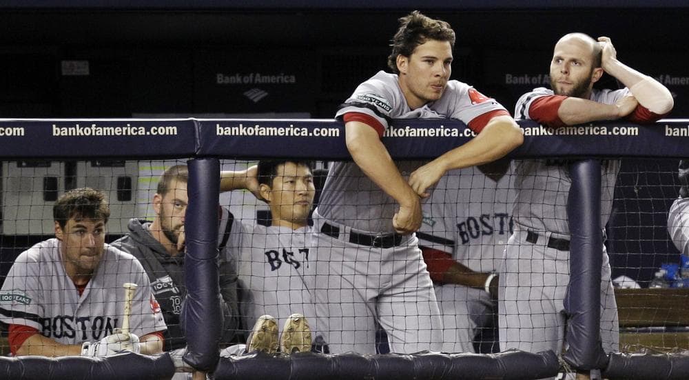 Sox players including Che-Husan Lin, third from left, and Danny Valencia and Dustin Pedroia, far right, watch from the dugout during their 10-2 loss to the Yankees in New York, Monday. (AP)