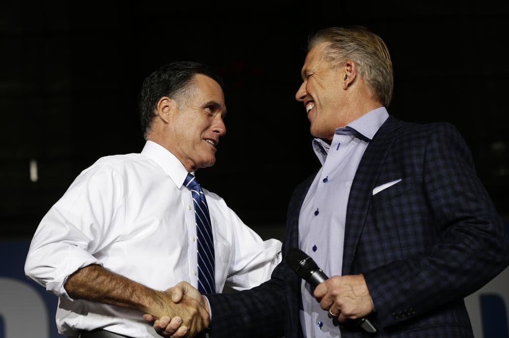Former NFL quarterback John Elway joined Republican presidential candidate Mitt Romney on the campaign trail. (AP/Charles Dharapak)