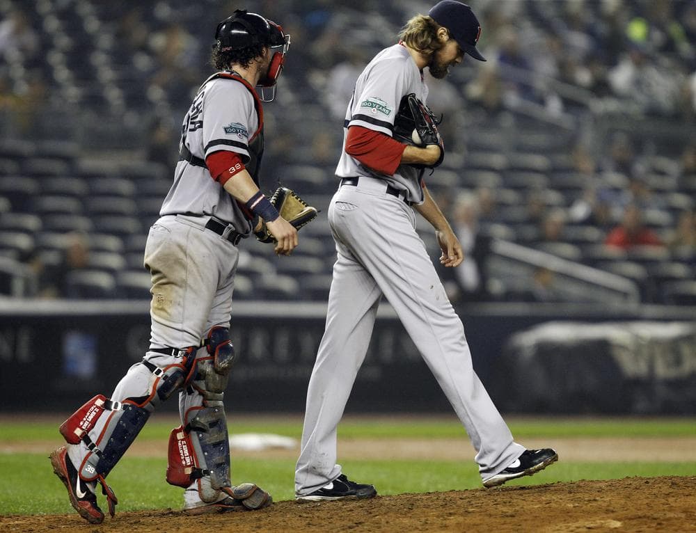 Red Sox catcher Jarrod Saltalamacchia, left, interacts with relief pitcher Andrew Miller in the 12th inning of their 4-3 loss to the Yankees in New York last night. (AP Photo)