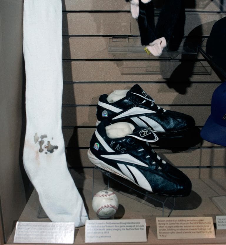 Boston Red Sox pitcher Curt Schilling's bloody sock and spikes worn in Game 2 of the World Series are on display at the National Baseball Hall of Fame in Cooperstown, N.Y., April 26, 2007. (Mike Groll/AP)