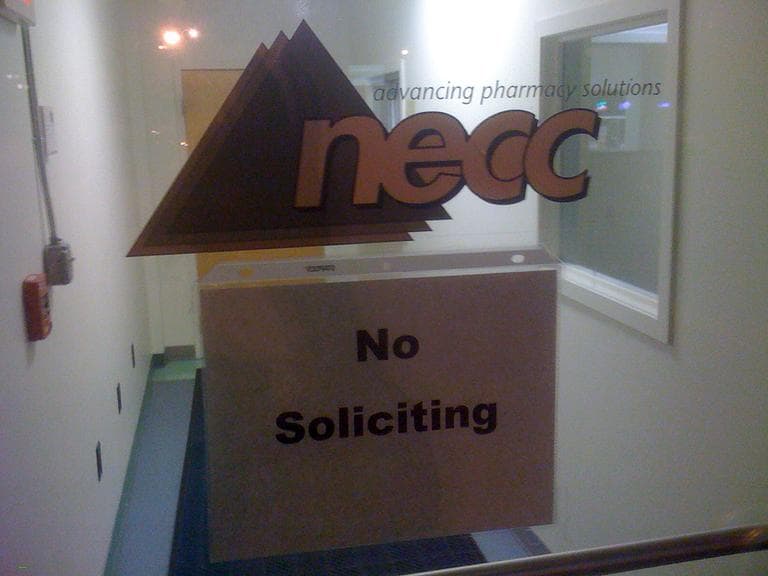 A sign on the door to the New England Compounding Center requests no soliciting at the Framingham, Mass. company. (AP)