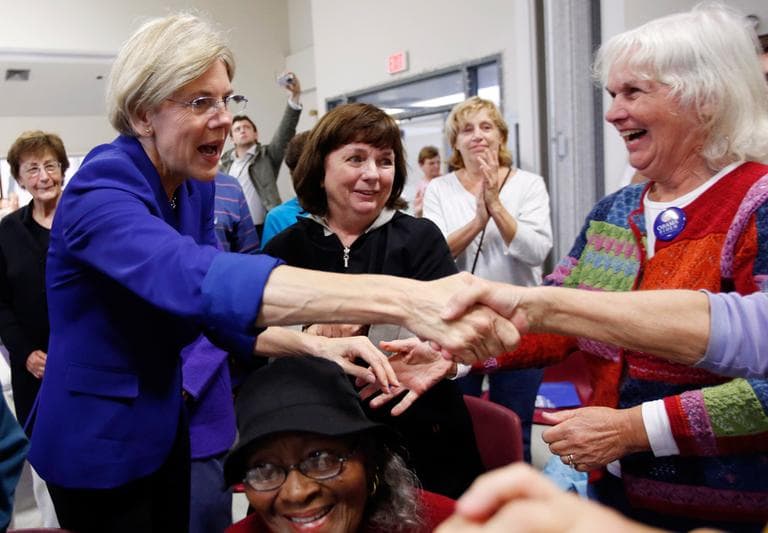 Democratic U.S. Senate candidate Elizabeth Warren, left, greets supporters during a campaign stop at a senior center in Medford Wednesday. (Michael Dwyer/AP)