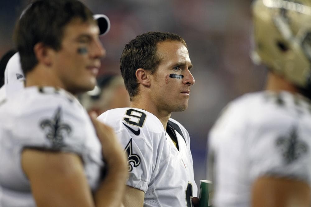 New Orleans Saints quarterback Drew Brees watches a preseason game from the sidelines. The Saints are 0-4 in regular season play. (AP/Michael Dwyer)