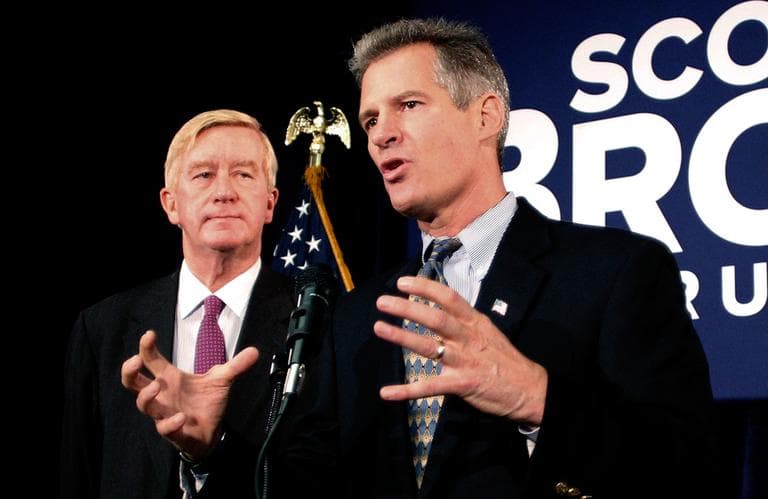 U.S. Sen. Scott Brown speaks with reporters as former Massachusetts Gov. William Weld looks on after Weld endorsed Brown in Boston Friday. (Winslow Townson/AP)