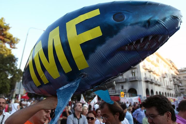 Protesters hold a shark balloon, featuring International Monetary Fund (IMF) in the northern Greek port city of Thessaloniki, Saturday, Sept. 8, 2012. Greek Prime Minister Antonis Samaras says the final round of austerity measures contains painful and unjust cuts but is necessary to restore Greece's credibility and continue to receive funding from creditors. (AP)