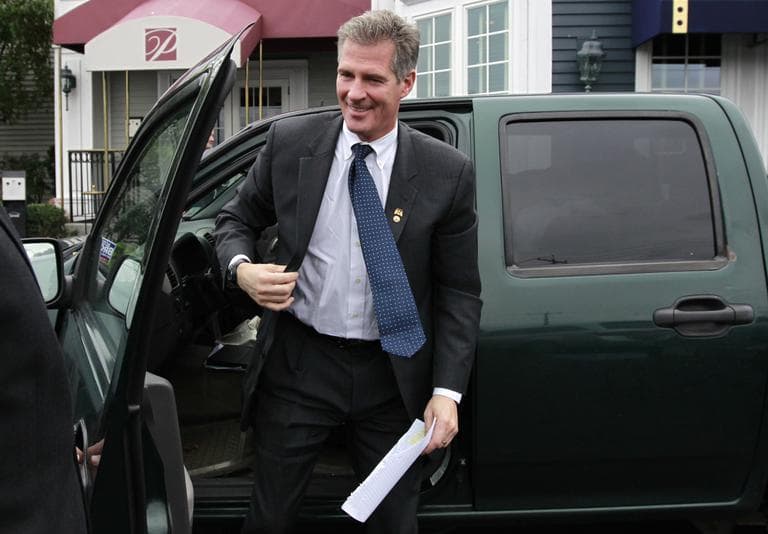 Sen. Scott Brown steps out of his pickup truck as he arrives at a campaign event in Dorchester on Tuesday, (AP)