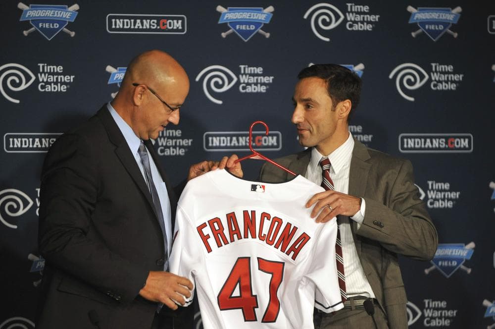 Terry Francona accepts a jersey from Cleveland Indians GM Chris Antonetti. (AP/David Richard)