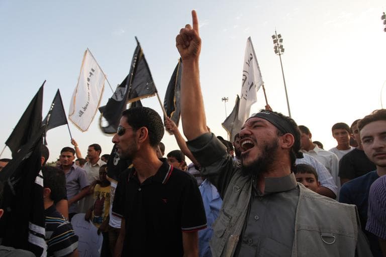 Libyan followers of the Ansar al-Shariah Brigades chant anti-U.S. slogans during a protest in September, as part of widespread anger over a film ridiculing Islam's Prophet Muhammad. The Libyan-based Islamic militant group Ansar al-Shariah is one of the leading suspects in the attack on the U.S. consulate in Libya that killed the U.S. ambassador and three other Americans. (AP/Mohammad Hannon)