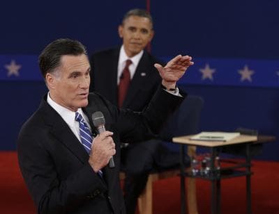 President Barack Obama listens as Republican presidential nominee Mitt Romney speaks during the second presidential debate on Tuesday. (AP)