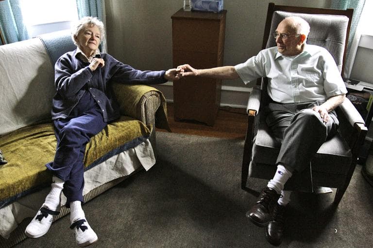 Alzheimer's patient Dorothy Eckert and her husband John Eckert hold hands at their home in Norristown, Pa. (AP/Matt Rourke)