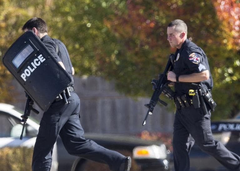 Police and swat team members respond to a shooting at the Azana Spa in Brookfield, Wis.  Sunday,Oct. 21, 2012.  (Tom Lynn/AP)