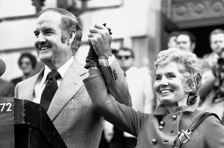 In this Oct. 31, 1972 photo, Sen. George McGovern holds up the hand of his wife Eleanor and announced to the crowd that it was their 29th wedding anniversary. (AP/Bob Schutz)