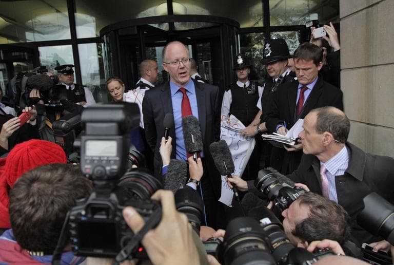 George Entwistle, center, the British Broadcasting Corporation (BBC) Director General, talks to members of the media on Tuesday. Entwistle told British lawmakers on Tuesday that it is too early to say whether sexual abuse was endemic within Britain's publicly funded national broadcaster. (AP/Lefteris Pitarakis)