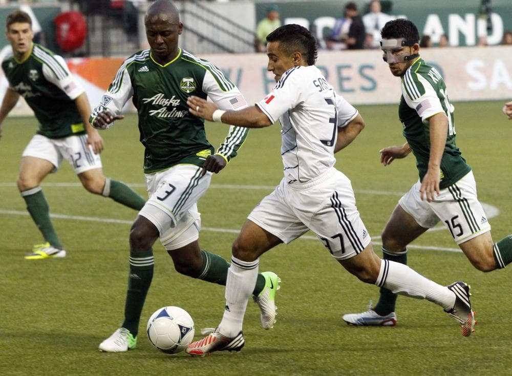 The Vancouver Whitecaps play the Portland Timbers in Portland, Ore. The team is the first ever from Canada to qualify for MLS postseason. (Don Ryan/AP)