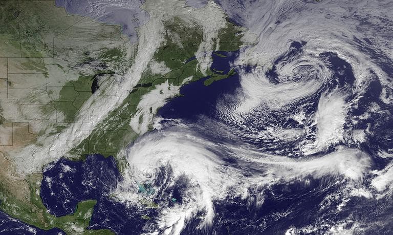 In this image taken Friday, Hurricane Sandy (center bottom) is seen. (AP/NOAA)