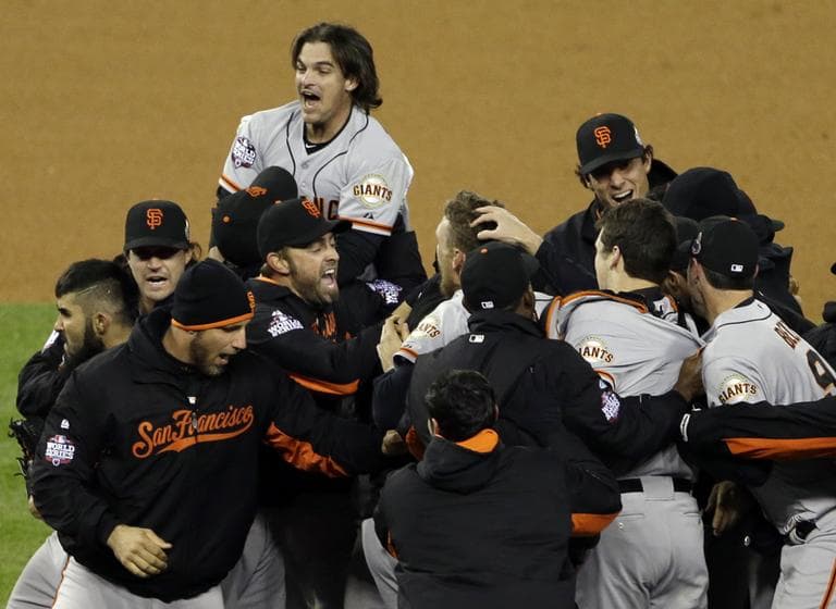The San Francisco Giants celebrate after winning Game 4 of the World Series against the Detroit Tigers on Sunday. (Paul Sancya/AP)