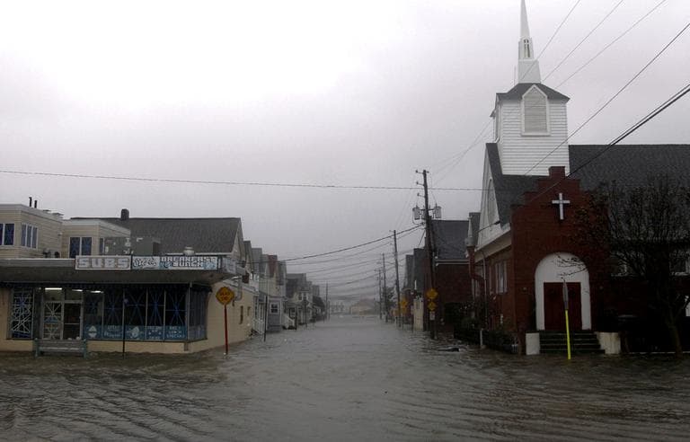 Waters flood Ocean Ave. in Sea Bright, N.J., on Monday. Hurricane Sandy continued on its path, as the storm forced the shutdown of mass transit, schools and financial markets, sending coastal residents fleeing, and threatening a dangerous mix of high winds and soaking rain. (AP/Seth Wenig)