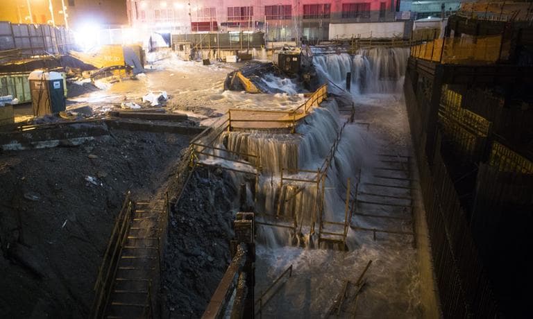 Sea water floods the Ground Zero construction site in New York City on Monday. (John Minchillo/AP)