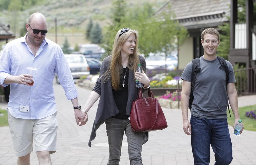 Facebook CEO Mark Zuckerberg, right, walks with Laura Arrillaga-Andressen, center, wife of Marc Andressen, left, at the Allen &amp; Company Sun Valley Conference in Sun Valley, Idaho, Wednesday, July 11, 2012. Marc Andreessen is founder of Netscape. (AP)