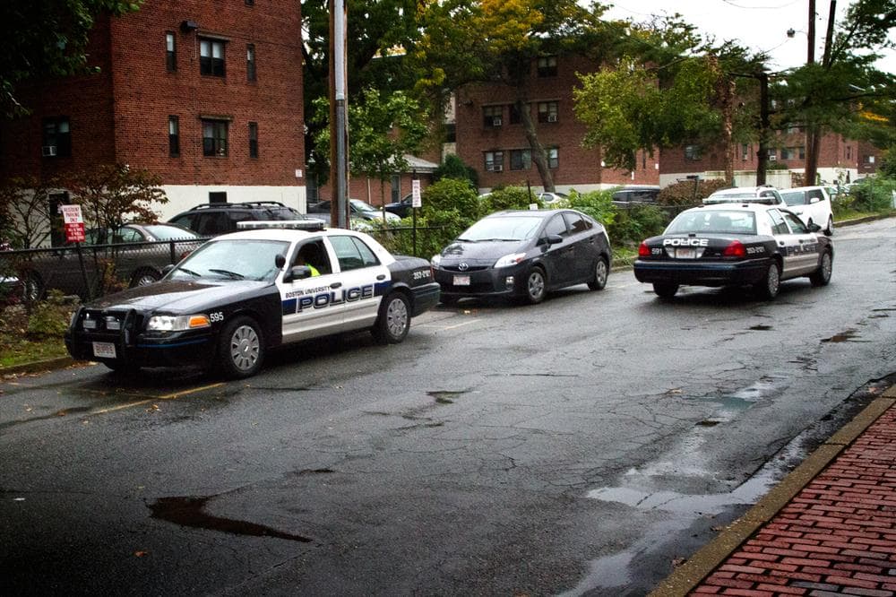 Boston University police cars patrol near the campus&#039; Boston/Brookline border on Wednesday. (Jesse Costa/WBUR)