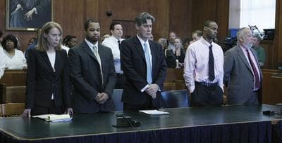 Edward Washington, second left, and Dwayne Moore, second right, stand with their defense attorneys during their March murder trial.(Pat Greenhouse, AP/Boston Globe/Pool)
