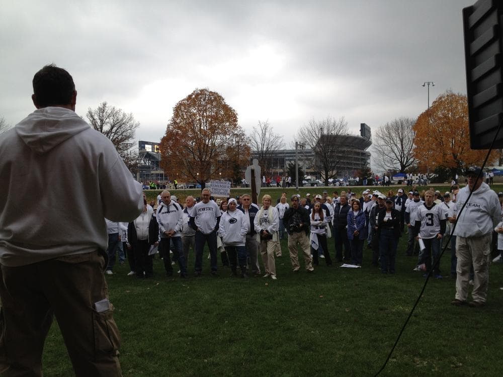 Penn State Trustee Anthony Lubrano addresses a group of angry alumni, as tailgaters around Beaver Stadium await kickoff against rival Ohio State. (Adam Ragusea/Georgia Public Broadcasting)
