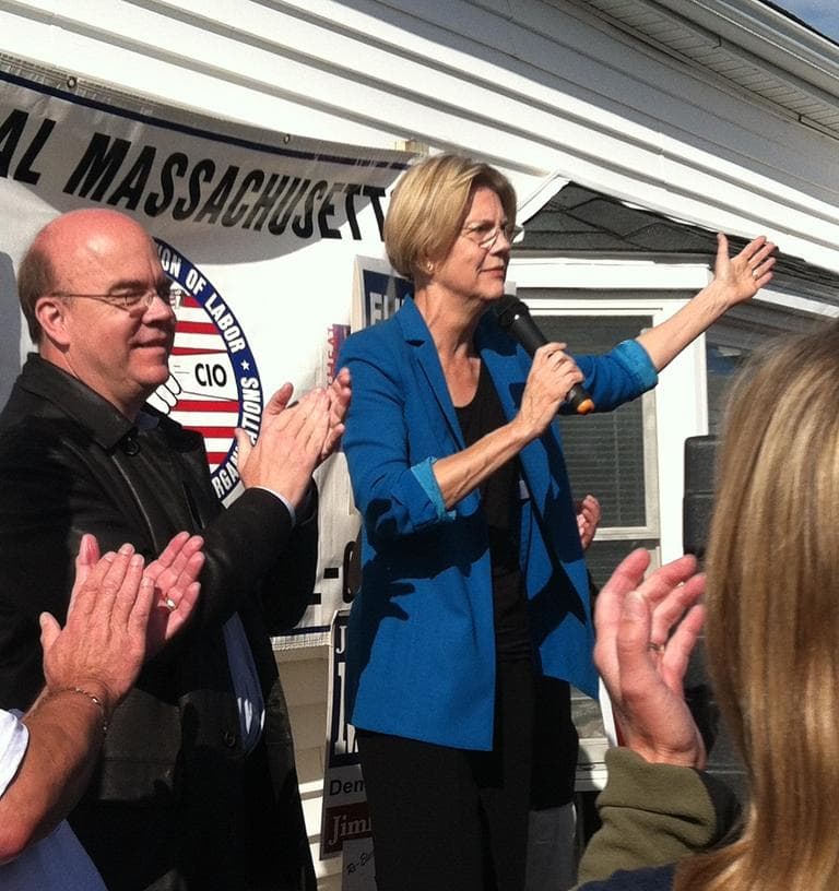 U.S. Rep. James McGovern applauds as Senate candidate Elizabeth Warren speaks to supporters at a rally in Auburn. (Elizabeth Brown for WBUR)